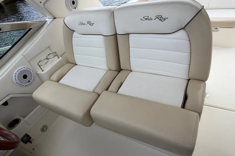 Slide: The Image of Luxury seating on 2012 Sea Ray Sundancer 350 boat, featuring beige and white upholstery. - 53