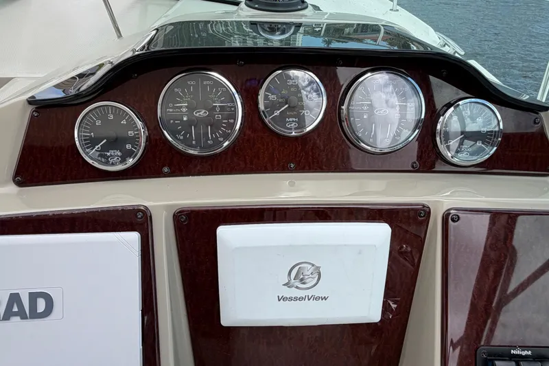 Slide: The Image of Dashboard of a 2012 Sea Ray Sundancer 350 with gauges and VesselView display. - 55