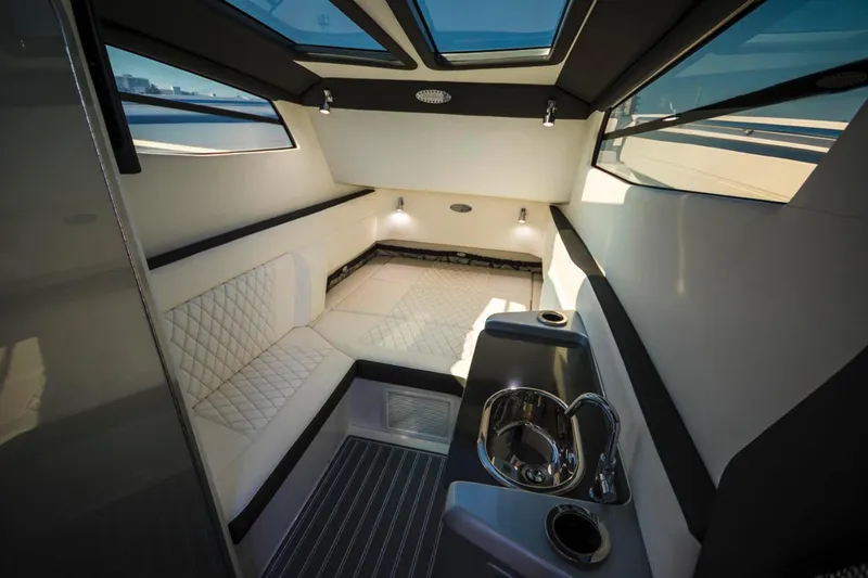 Slide: The Image of Manufacturer Provided Image: 2020 Nor-Tech 450 Sport Center Console helm with navigation display and cabin entrance. - 23