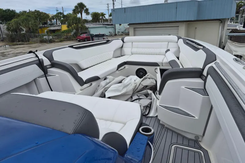 Slide: The Image of 2020 Nor-Tech 450 Sport Center Console boat on trailer, blue exterior, overcast sky. - 3