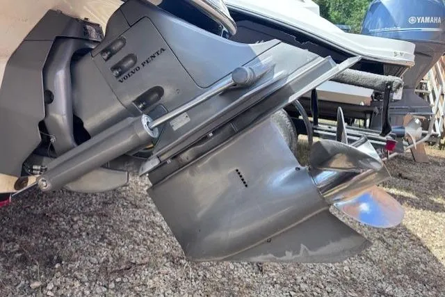 Slide: The Image of 2005 Crownline 202 BR boat with Volvo Penta outdrive, parked on gravel. - 3