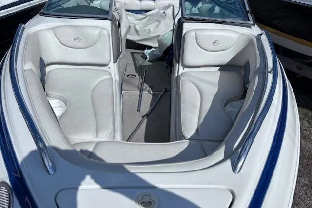 Slide: The Image of 2005 Crownline 202 BR boat interior with white seating and blue accents. - 5