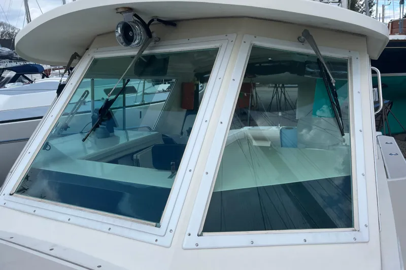 Slide: The Image of 1998 Albin 28 Tournament Express boat with large front windows and wipers. - 29