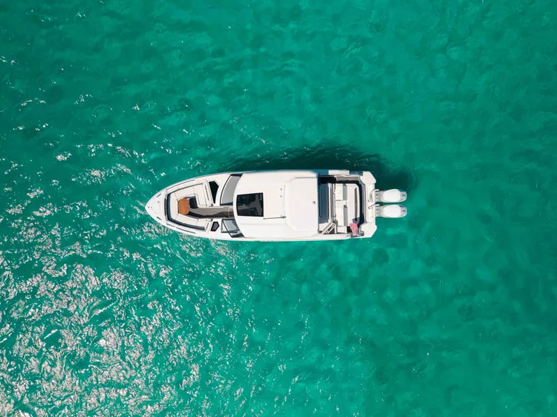 Slide: The Image of Aerial view of 2024 Cobalt R35 boat on turquoise water. - 11