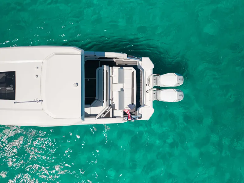 Slide: The Image of Aerial view of 2024 Cobalt R35 boat on turquoise water. - 12