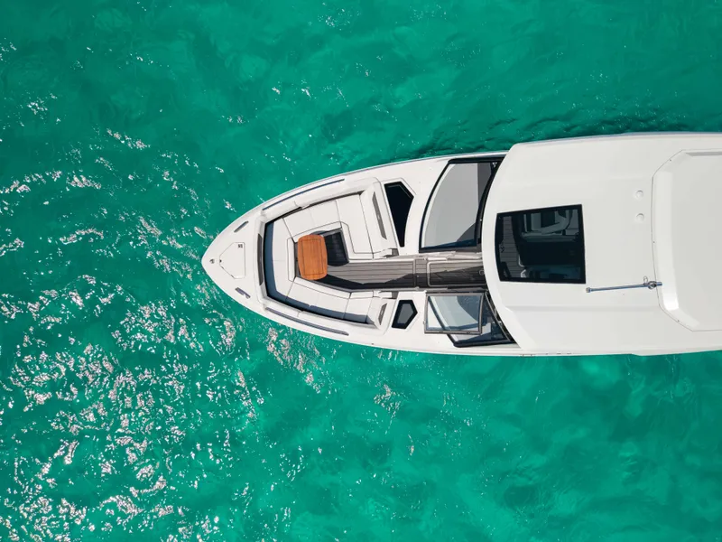 Slide: The Image of Aerial view of 2024 Cobalt R35 yacht on turquoise water. - 13