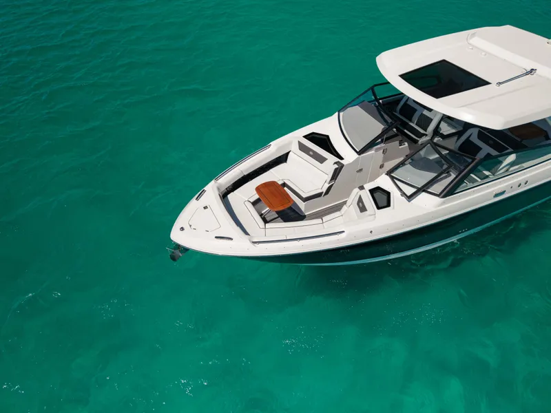Slide: The Image of Luxurious 2024 Cobalt R35 boat on turquoise water. - 14