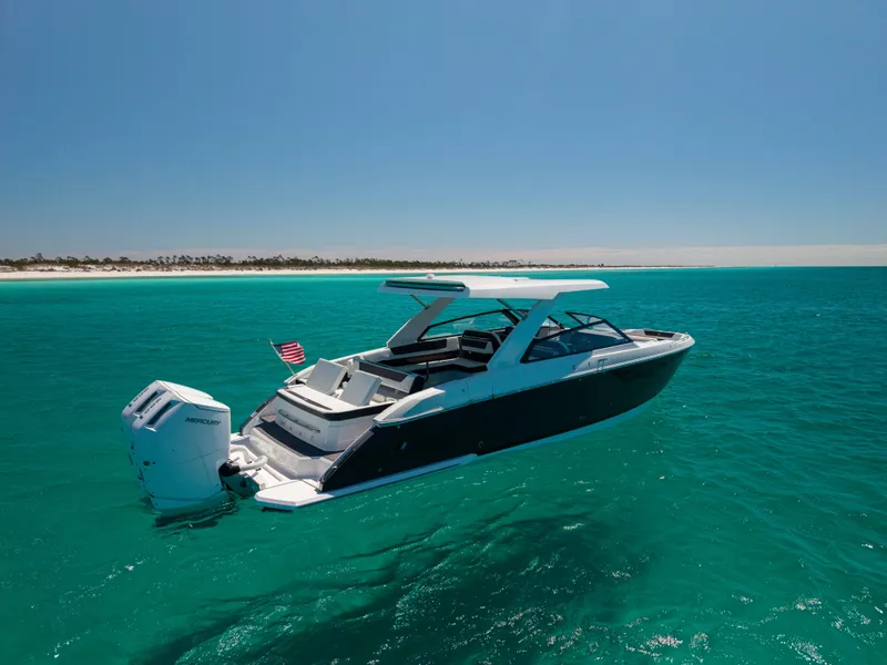 Slide: The Image of 2024 Cobalt R35 boat on turquoise water. - 15