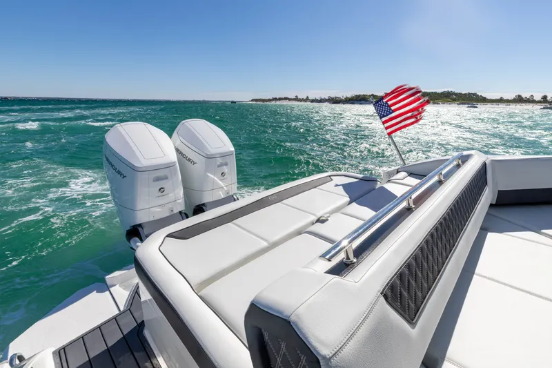 Slide: The Image of 2024 Cobalt R35 boat on open sea with US flag. - 20