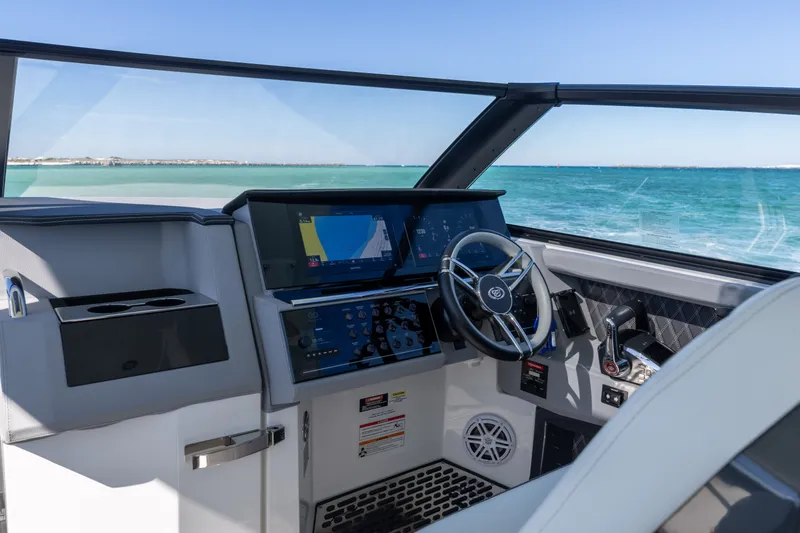 Slide: The Image of Interior of 2024 Cobalt R35 boat with modern helm station. - 24