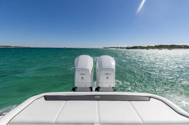 Slide: The Image of 2024 Cobalt R35 boat with twin outboard engines on open water. - 31