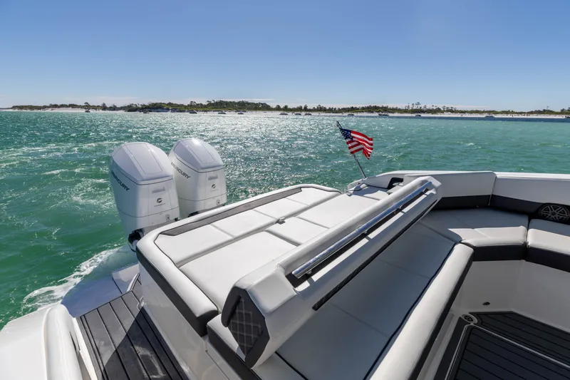 Slide: The Image of 2024 Cobalt R35 boat on open water with American flag. - 32