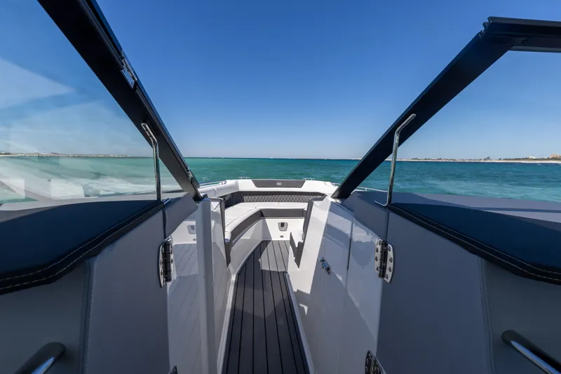 Slide: The Image of Cobalt R35 2024 boat on open sea under clear sky. - 35
