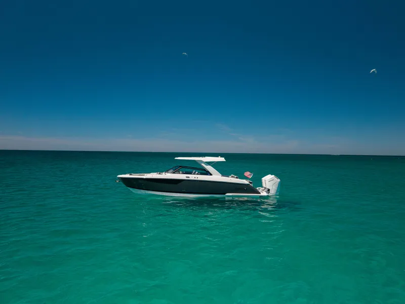Slide: The Image of 2024 Cobalt R35 boat on turquoise sea under blue sky. - 5