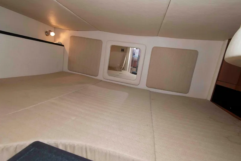 Slide: The Image of Interior cabin of 2007 Sea Ray 290 Sundancer with beige upholstery and lighting. - 13