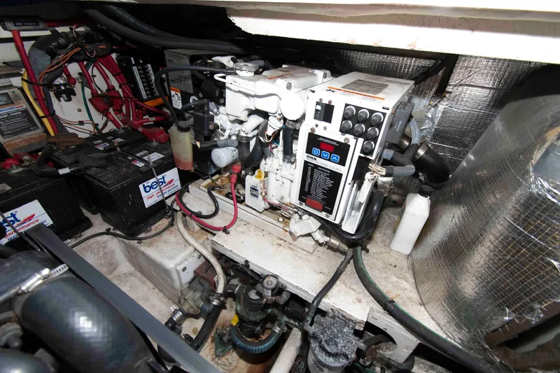 Slide: The Image of Engine room of 2007 Sea Ray 290 Sundancer with generator and batteries. - 16