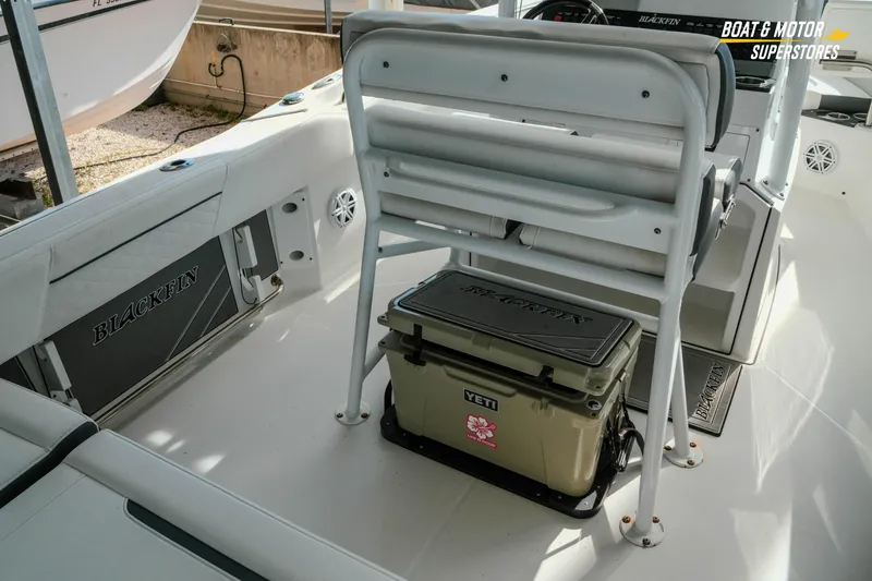 Slide: The Image of 2022 Blackfin 222 CC boat interior with seating and Yeti cooler. - 11