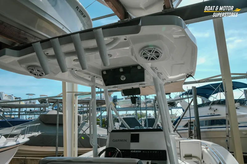 Slide: The Image of 2022 Blackfin 222 CC boat interior with Garmin electronics, docked at marina. - 12