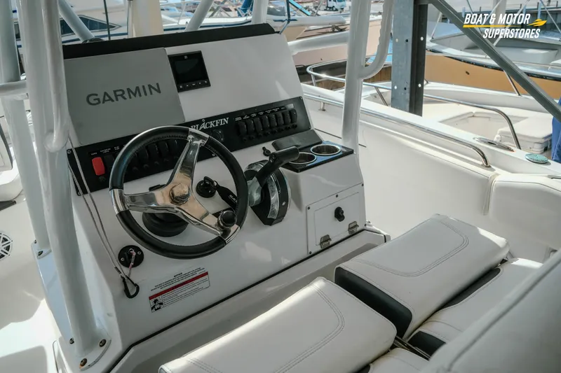Slide: The Image of 2022 Blackfin 222 CC boat console with Garmin navigation system and steering wheel. - 15