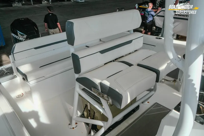 Slide: The Image of 2022 Blackfin 222 CC boat interior with white seating and Mercury engine. - 35