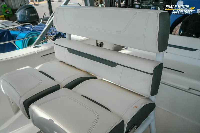 Slide: The Image of 2022 Blackfin 222 CC boat interior seating with white and gray upholstery. - 39