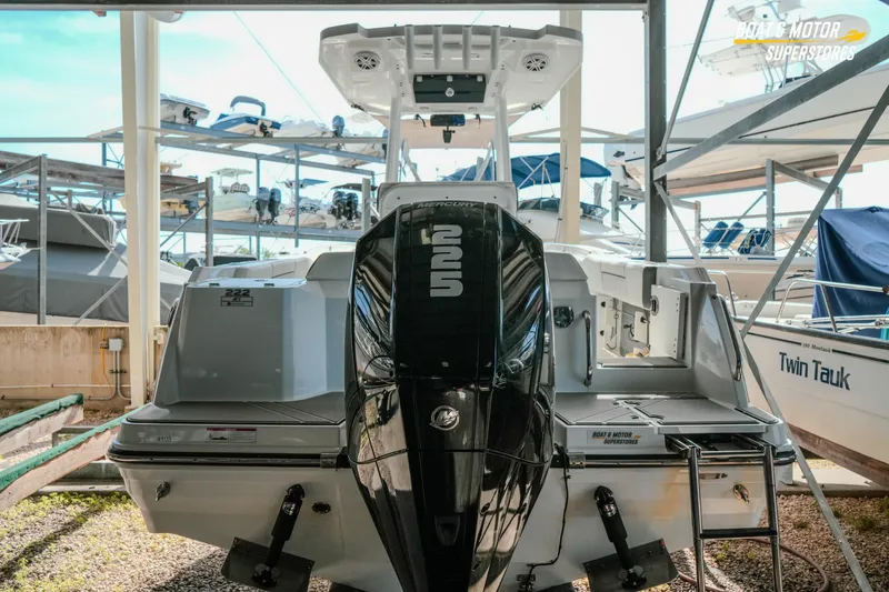 Slide: The Image of 2022 Blackfin 222 CC boat with powerful outboard motor in storage facility. - 4