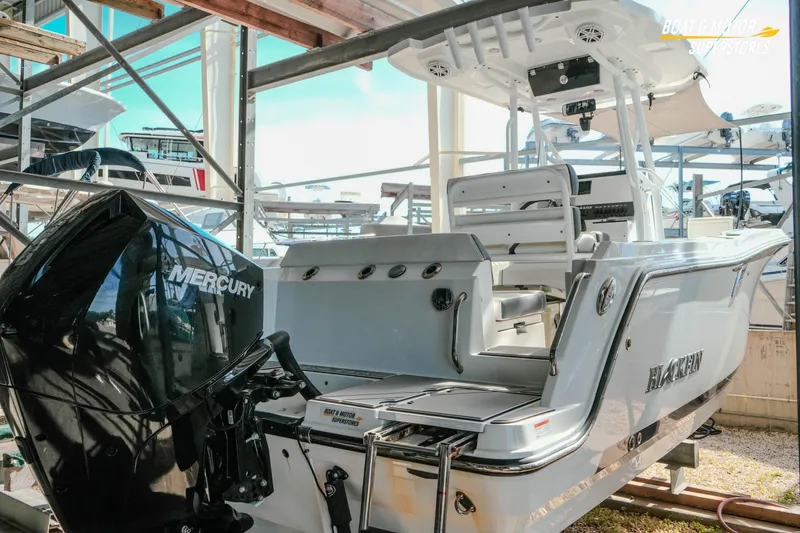 Slide: The Image of 2022 Blackfin 222 CC boat with Mercury engine in storage facility. - 5