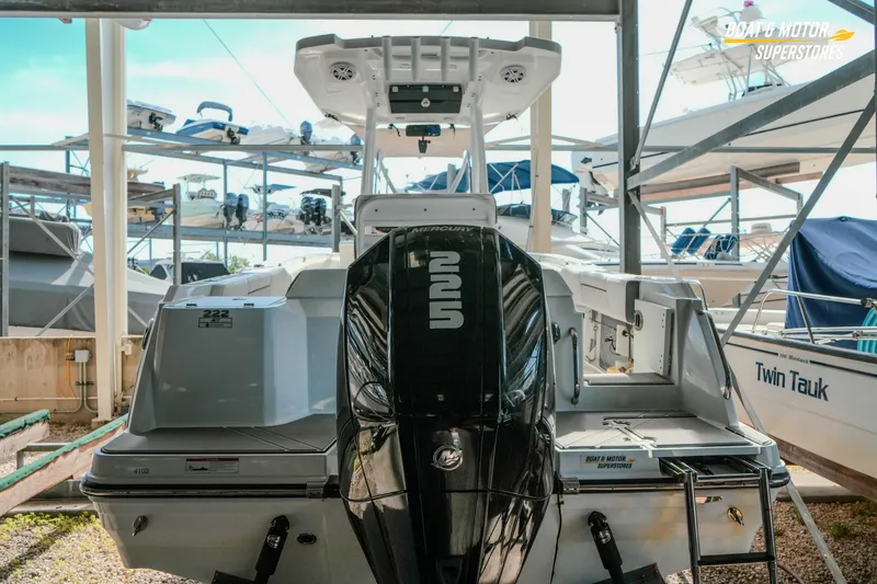 Slide: The Image of 2022 Blackfin 222 CC boat with Mercury engine in storage facility. - 50