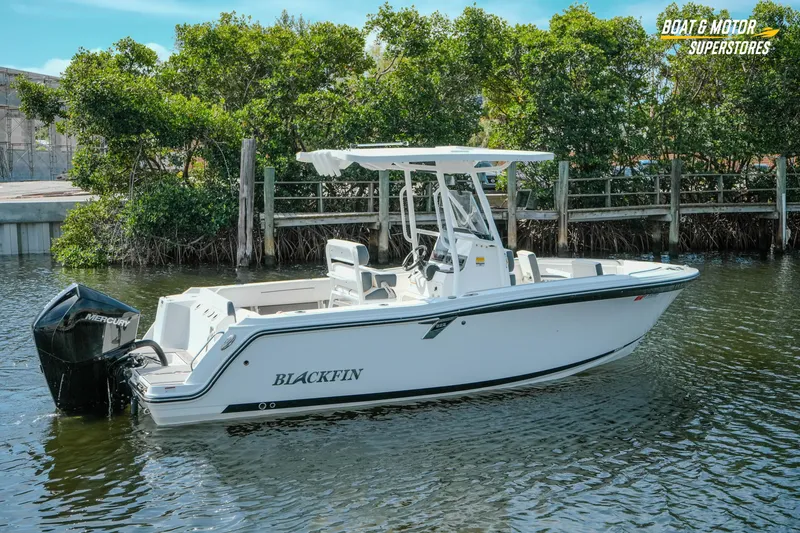 Slide: The Image of 2022 Blackfin 222 CC boat with Mercury engine on calm water near mangroves. - 52