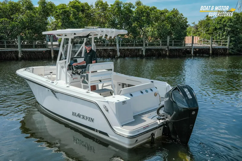 Slide: The Image of 2022 Blackfin 222 CC boat on water, featuring a Mercury outboard engine. - 57
