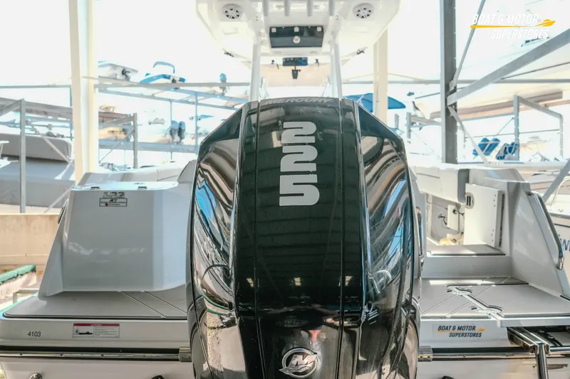 Slide: The Image of 2022 Blackfin 222 CC boat with Mercury engine in showroom display. - 9