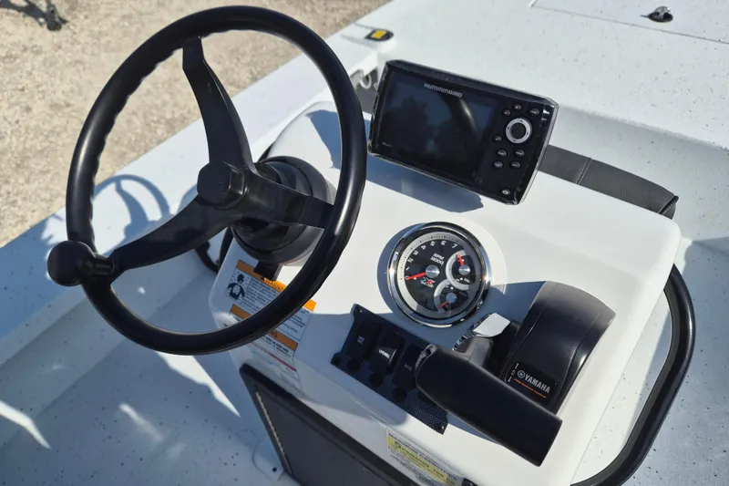 Slide: The Image of Steering console of 2026 Xpress Skiff 185 with navigation equipment and Yamaha controls. - 10