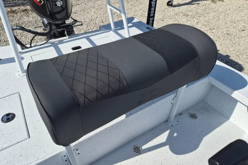 Slide: The Image of 2026 Xpress Skiff 185 boat seat with diamond-pattern upholstery. - 11