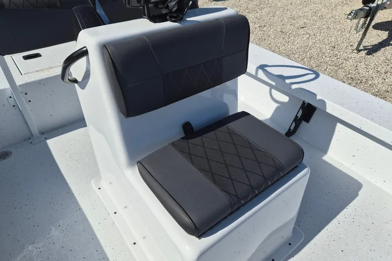 Slide: The Image of 2026 Xpress Skiff 185 boat seat with black upholstery and diamond stitching. - 15