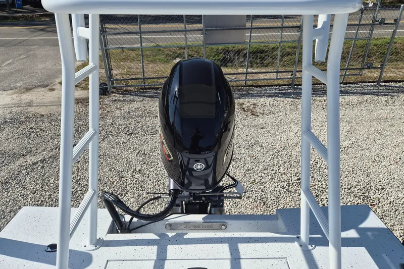 Slide: The Image of 2026 Xpress Skiff 185 with Yamaha outboard motor, viewed from above. - 19