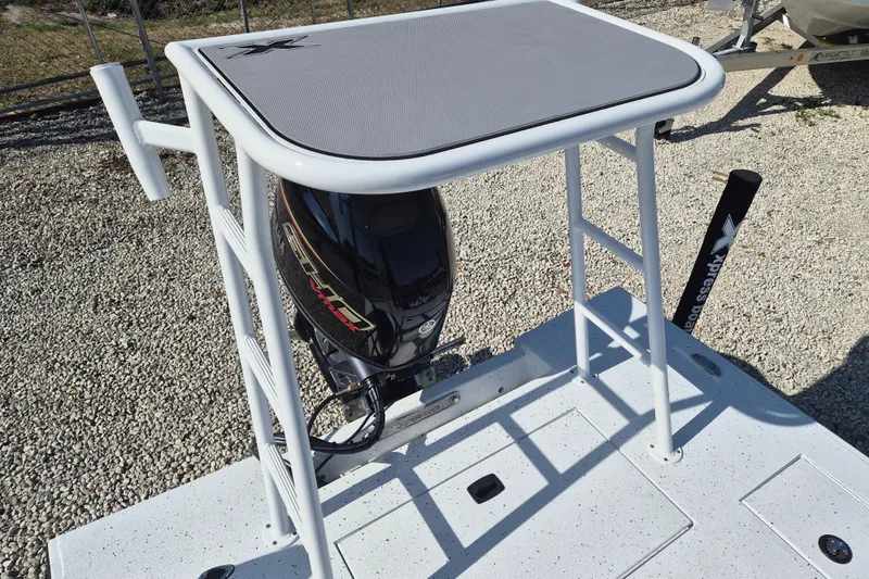 Slide: The Image of 2026 Xpress Skiff 185 boat with motor and elevated platform. - 5