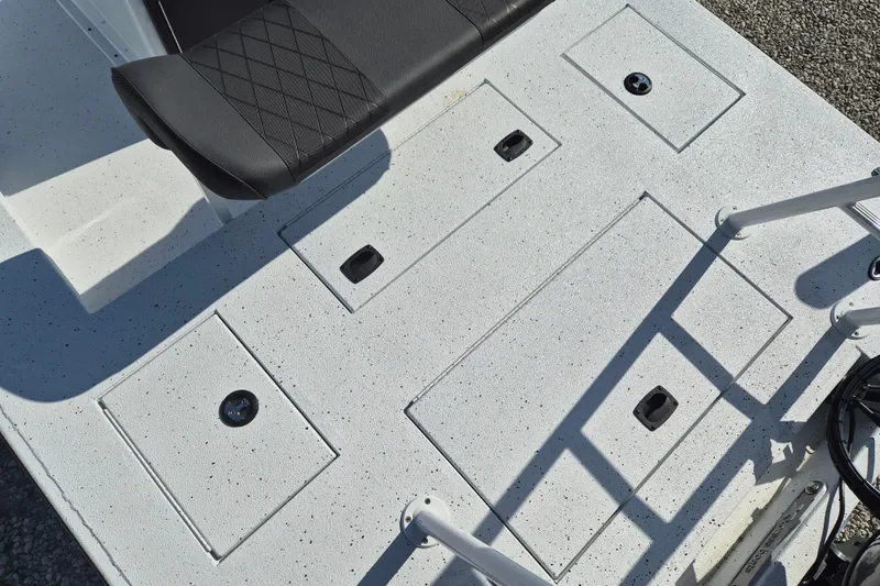 Slide: The Image of 2026 Xpress Skiff 185 boat deck with storage compartments and seating. - 7