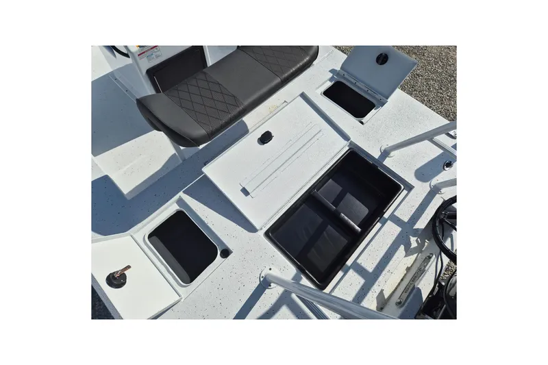 Slide: The Image of 2026 Xpress Skiff 185 boat interior with storage compartments and seating. - 8