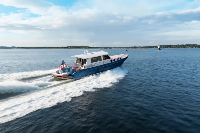 The Image of 2027 Hunt Yachts 56 Ocean Express cruising on open water under a clear sky. - 0