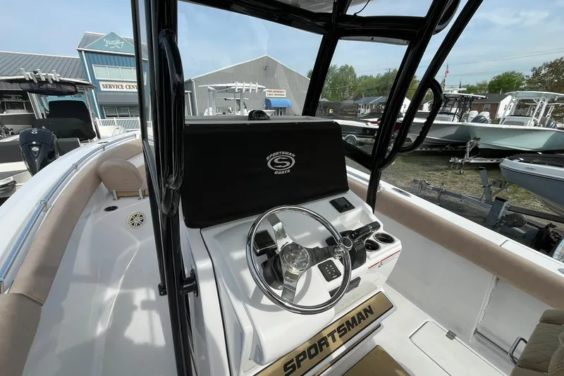 Slide: The Image of 2020 Sportsman Open 252 Center Console boat interior with steering wheel and controls. - 11