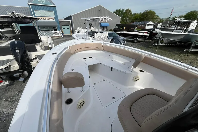 Slide: The Image of 2020 Sportsman Open 252 Center Console boat at a service center display. - 4