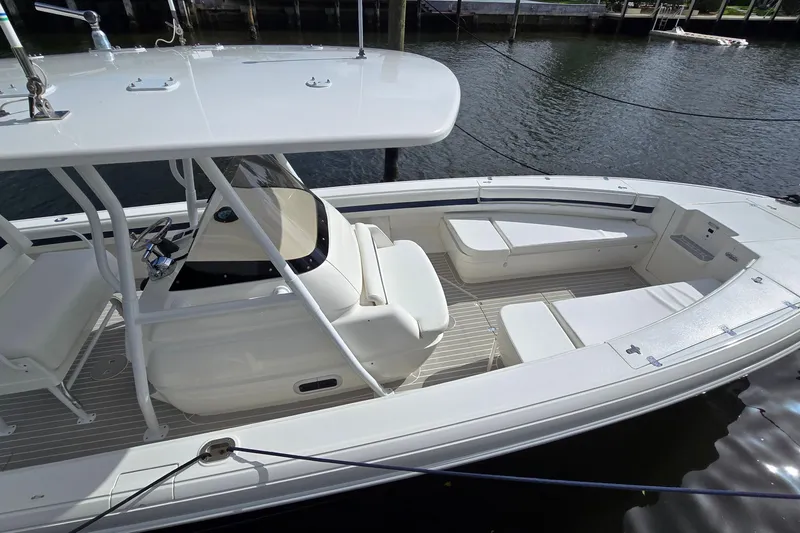 Slide: The Image of 2007 Intrepid 323 Open boat with sleek white design and spacious seating area. - 3