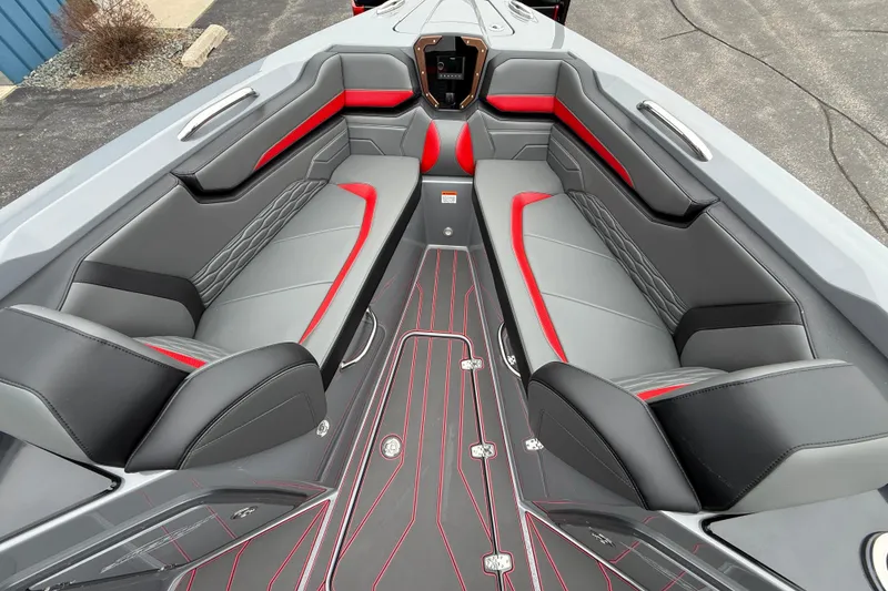 Slide: The Image of 2025 Sunsation 32 CCX boat interior with sleek gray and red seating design. - 13