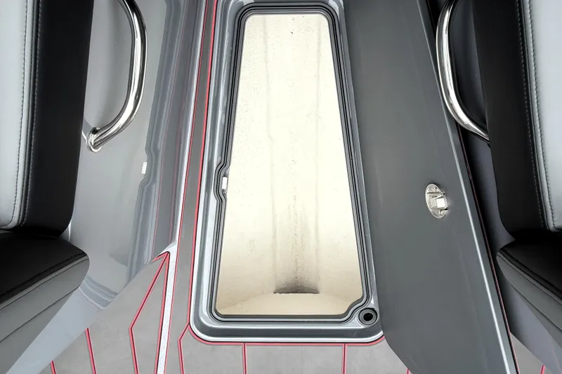 Slide: The Image of 2025 Sunsation 32 CCX boat interior with open storage compartment and sleek design. - 16