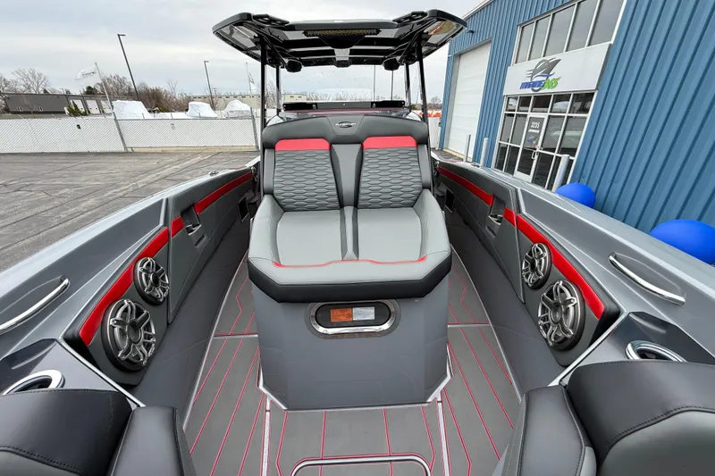 Slide: The Image of 2025 Sunsation 32 CCX boat interior with modern seating and audio system. - 17