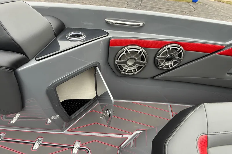 Slide: The Image of 2025 Sunsation 32 CCX boat interior with speakers, storage compartment, and stylish seating. - 18