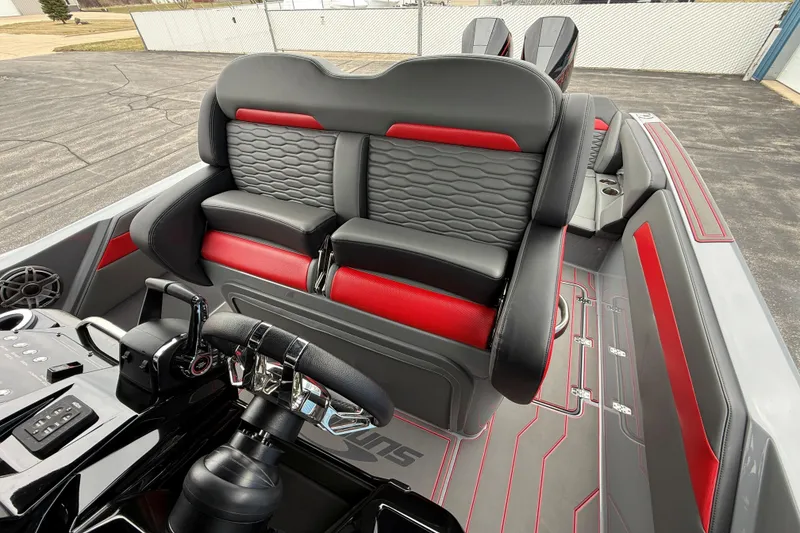 Slide: The Image of 2025 Sunsation 32 CCX boat interior with black and red seating, modern steering console. - 21