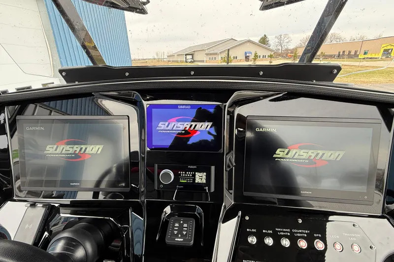 Slide: The Image of Dashboard of 2025 Sunsation 32 CCX boat with Garmin and Simrad displays. - 29