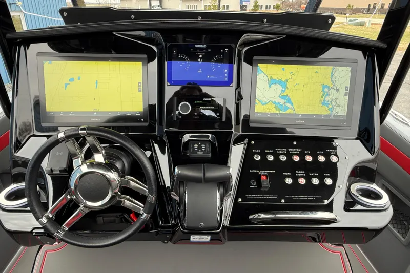 Slide: The Image of 2025 Sunsation 32 CCX dashboard with dual Garmin displays and modern controls. - 30