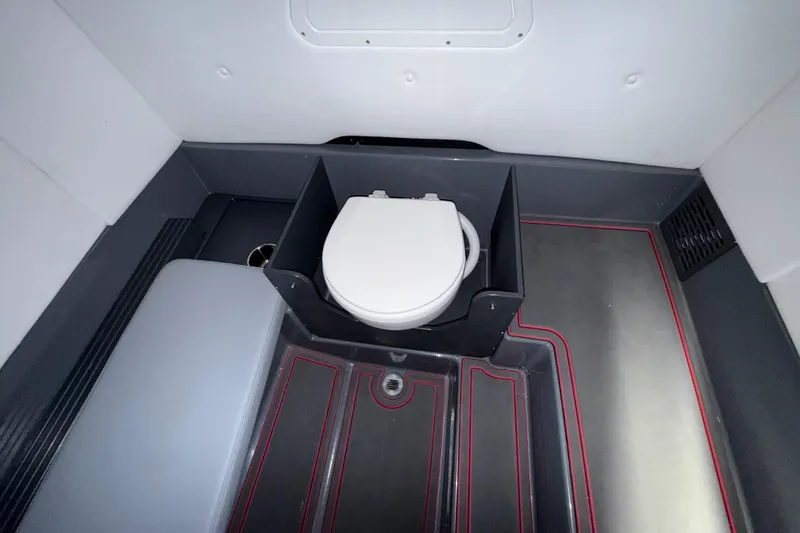 Slide: The Image of 2025 Sunsation 32 CCX boat interior with modern marine toilet setup. - 32
